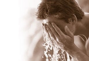men washing his face